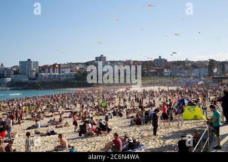 Kites fly in the sky over Bondi Beach in Sydney’s east during the Festival of the Winds kite flying festival. Stock Photo