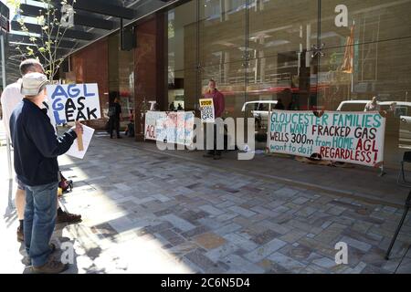 Protesters with signs against Coal Seam Gas and fracking in