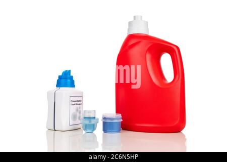 Comparison of regular and concentrated laundry liquid detergent against white background. Stock Photo