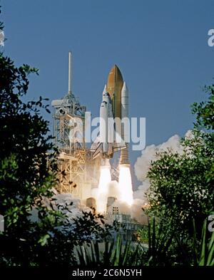 (29 Oct. 1998) --- Partially framed by Florida foliage, the space shuttle Discovery lifts off Launch Pad 39B to begin a nine-day mission in Earth orbit. Launch was at 2:19 p.m. (EST), Oct. 29, 1998. Onboard were Curtis L. Brown Jr., Steven W. Lindsey, Scott E. Parazynski, Steven K. Robinson, Pedro Duque, United States Senator John H. Glenn Jr. and Chiaki Naito-Mukai.  Duque is a mission specialist representing the European Space Agency (ESA) and Mukai is a payload specialist representing Japan's National Space Development Agency (NASDA). Glenn, making his second spaceflight but his first in 36 Stock Photo