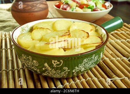 Scalloped Potato And Smoked Fish Pot, Smoked haddock and potato gratin Stock Photo