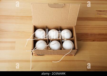 Traditional white household wax candles with brown paper packaging. Emergency  lighting electricity backup Stock Photo - Alamy