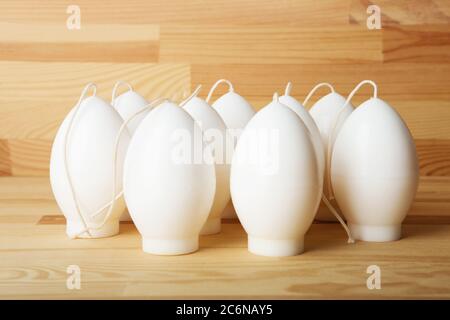 Traditional white household wax candles with brown paper packaging. Emergency  lighting electricity backup Stock Photo - Alamy