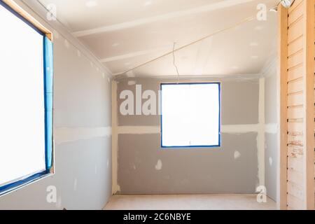 Renovations in old Queenslander style home with new plasterboard and windows Stock Photo