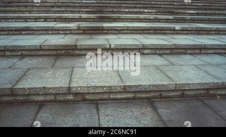 Texture of concrete steps. Stone staircase in centre of city. Outdoor stone steps background texture made of multitude slab. Stock Photo