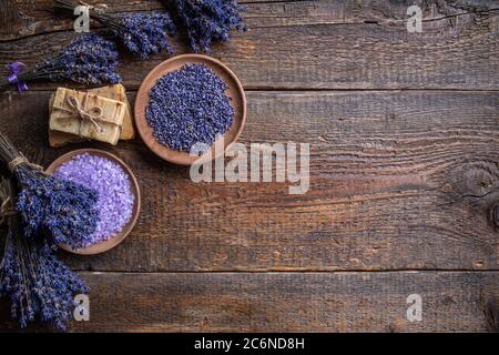 Lavender spa products and lavender flowers on a wooden background Stock Photo