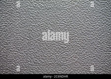 Texture of an aluminum roller shutter in a factory building. Stock Photo