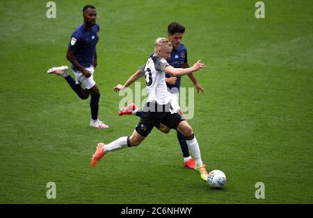 Derby County's Louie Sibley battles for the ball with Brentford's Rico Henry (left) and Christian Norgaard (right) during the Sky Bet Championship match at Pride Park, Derby. Stock Photo