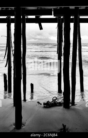 Low angle view of the old wooden Hua Hin Fishing Pier, Hua Hin, Thailand Stock Photo