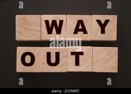 Way out words printed on wooden cubes blocks. Business crisis strategy concept Stock Photo