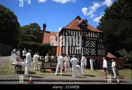 Team talk prior to a village cricket game starts at Tilford Cricket Club, Farnham. Stock Photo