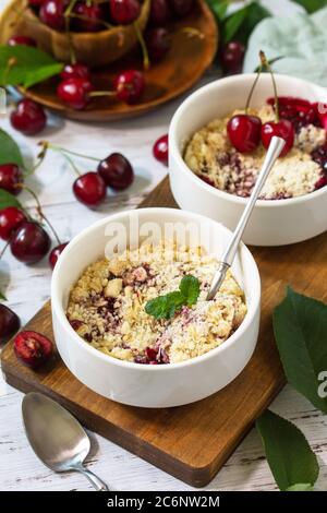 Delicious cherry pie on kitchen table Stock Photo - Alamy