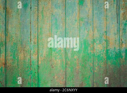 Green ragged texture on the background. Metallic green yellow old texture Stock Photo