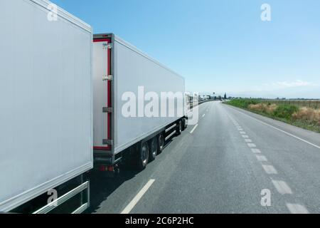Mega-truck or Road train, special vehicle consisting of a truck and two trailers approved to transport 60 tons. Stock Photo