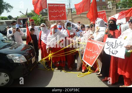 Peshawar, Pakistan. 11th July, 2020. Awami National Party women activists stage protest rally against price hike near Peshawar press club on Saturday. (Photo by Hussain Ali/Pacific Press) Credit: Pacific Press Agency/Alamy Live News Stock Photo