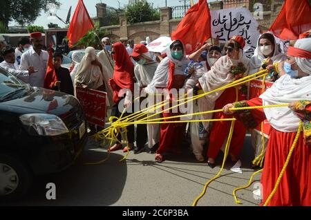 Peshawar, Pakistan. 11th July, 2020. Awami National Party women activists stage protest rally against price hike near Peshawar press club on Saturday. (Photo by Hussain Ali/Pacific Press) Credit: Pacific Press Agency/Alamy Live News Stock Photo