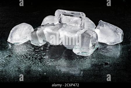 Ice cubes on black surface Stock Photo