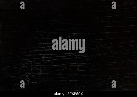 Wooden background of an old cracked table. Dark lacquered table with long cracks Stock Photo
