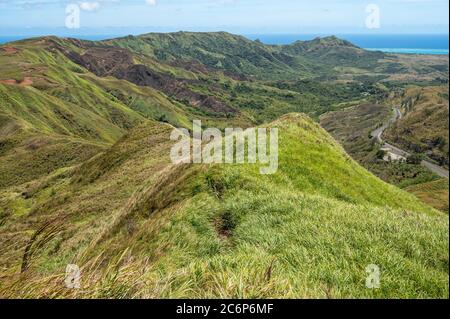 Lush grass fields on the southern ridges of Guam from the top of mount Lamlam. Stock Photo