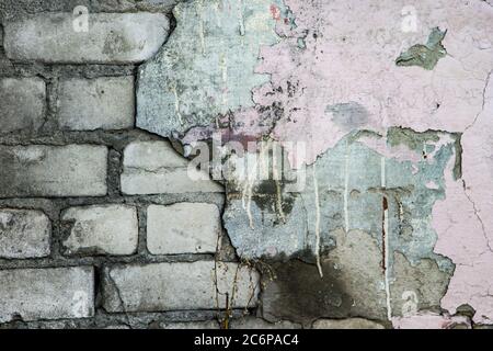 Old stucco crumbling from the wall Stock Photo