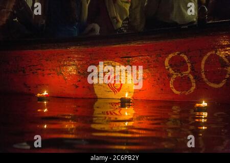 Varanasi burning candles floating in the Ganges river, India. Stock Photo