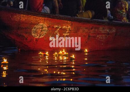 Varanasi burning candles floating in the Ganges river, India. Stock Photo