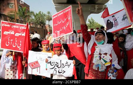 Activists of Awami National Party (ANP) Women Wing are holding protest demonstration against price hike of petroleum products and federal budget, at Peshawar press club on Saturday, July 11, 2020. Stock Photo