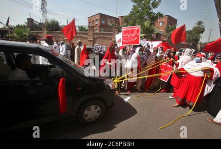 Activists of Awami National Party (ANP) Women Wing are holding protest demonstration against price hike of petroleum products and federal budget, at Peshawar press club on Saturday, July 11, 2020. Stock Photo