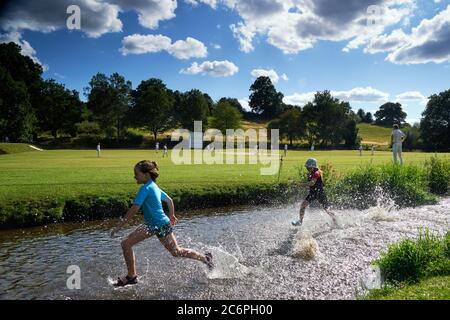 Abinger Hammer Cricket Club play Worplesdon and Burpham cricket club, Surrey. Stock Photo