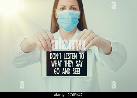 Text sign showing Dont Listen To What They Say Go And See. Business photo text to travel and explore the world Laboratory technician featuring empty s Stock Photo