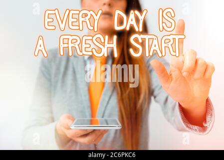 Handwriting text Every Day Is A Fresh Start. Conceptual photo an opportunity to start over without prejudice Model with pointing hand finger symbolizi Stock Photo
