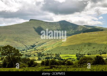 Pen y Fan and Cribyn from Mynydd Illtyd in the Brecon Beacons National Park in south Wales on a sunny and cloudy summer day in July. Stock Photo