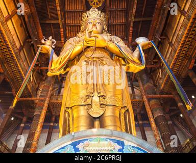 ULAANBAATAR, MONGOLIA - JULY 12, 2016: Avalokitesvara statue inside the Gandantegchinlen or Gandan Monastery. Its a Tibetan Buddhist monastery in the Stock Photo