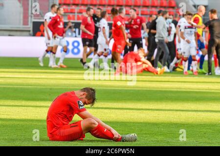 Ingolstadt, Deutschland. 11th July, 2020. firo Football: Football: 11.07.2020 Relegation game Relegation 2020 to 2.Bundesliga FC Ingolstadt 04 - FC Nuremberg 3: 1 game Michael Heinloth, whole figure, disappointment, disappointed, at the ground DFB/DFL regulations prohibit any use of photographs as image sequences and/or quasi-video., Oliver STRISCH/pool/via/firosportphoto | usage worldwide Credit: dpa/Alamy Live News Stock Photo