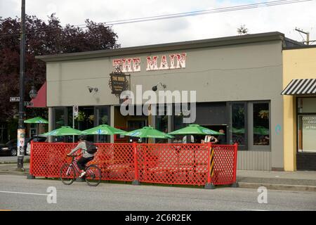 Vancouver, Canada. July10, 2020. Restaurants are expanding seating areas onto streets in order to accommodate more outdoor dining during the COVID-19 global pandemic. Stock Photo