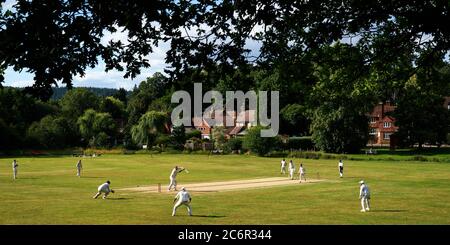 Abinger Hammer Cricket Club play Worplesdon & Burpham cricket club, Surrey. Stock Photo