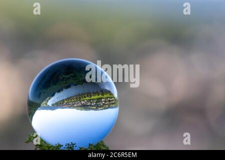 Crystal ball with lriver Moselle valley and defocused background Stock Photo