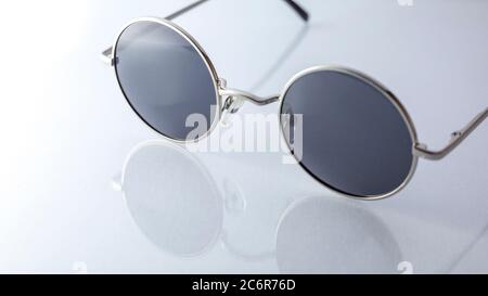 Classic round sunglasses on white background. circle sunglasses isolated. lennon glasses Stock Photo