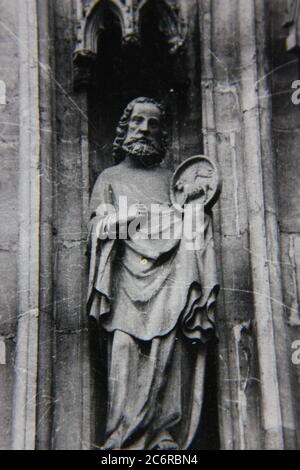Fine 70s vintage black and white lifestyle photography of carved stone statues of famous saints. Stock Photo