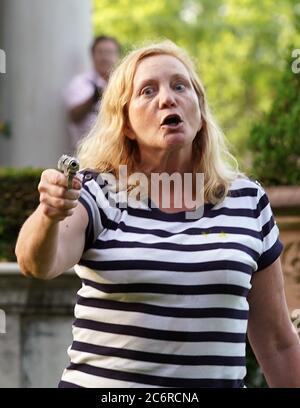 In this photo taken Saturday July 25, 2015, a jogger passes through the ...