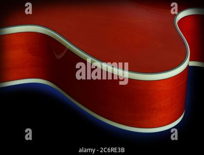 Detail of an Ibanez AF75 Hollowbody Electric Guitar in transparent orange showing the curved shape of the body, the upper bout, and the binding. Stock Photo