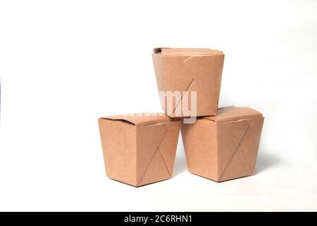 pyramid of three wok paper boxes isolated on white background. Image contains copy space Stock Photo