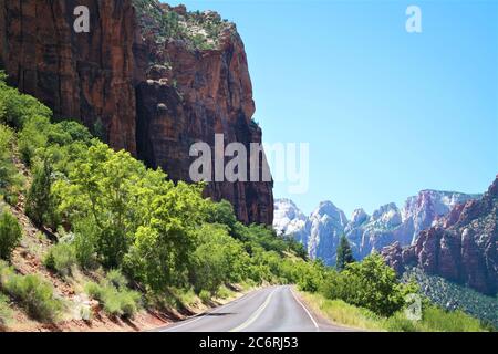 Road with Navajo White Sandstone Mesas in the Distance, Zion National Park, Utah Stock Photo