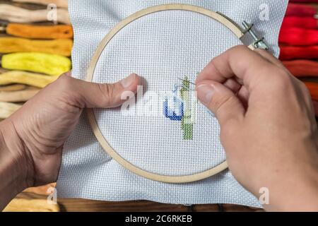 Embroidery in the Lady's hands needlework accessories Stock Photo