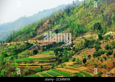 Agricultural farming fields at a rural area in Nepal, seen from a road connecting Pokhara and Kathmandu. Stock Photo