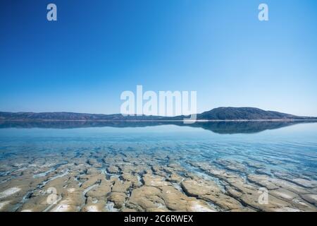 The bottom and surface with crystal clean water of Salda Lake in Turkey. Travel Tourism concept. High quality photo Stock Photo