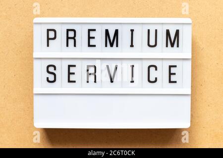 Lightbox with word premium service on wood background Stock Photo