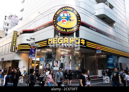 Tokyo, Japan - May 2, 2019 : Unidentified people walk in front of Mega Don Quitjote Shibuya Honten. Stock Photo