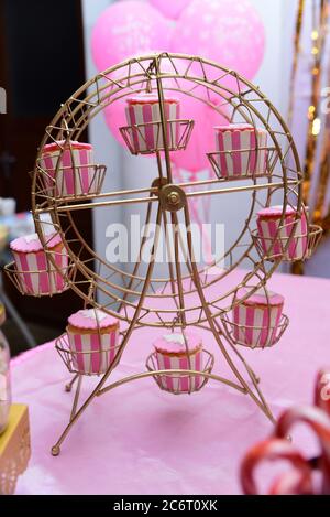 Cupcake display stand at a kid’s birthday party. Stock Photo