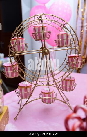 Cupcake display stand at a kid’s birthday party. Stock Photo